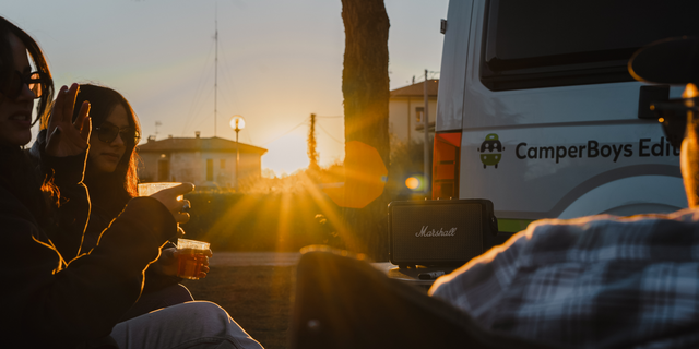 Sunset in the city next to a camper