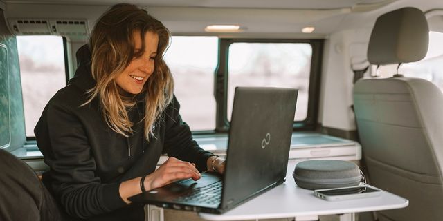 Melanie working remote from a CamperBoys van