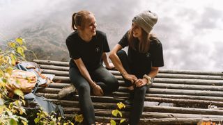 Two girls on a mountain pier