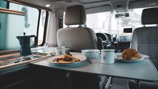 VW Beach interior shot with breakfast table set.